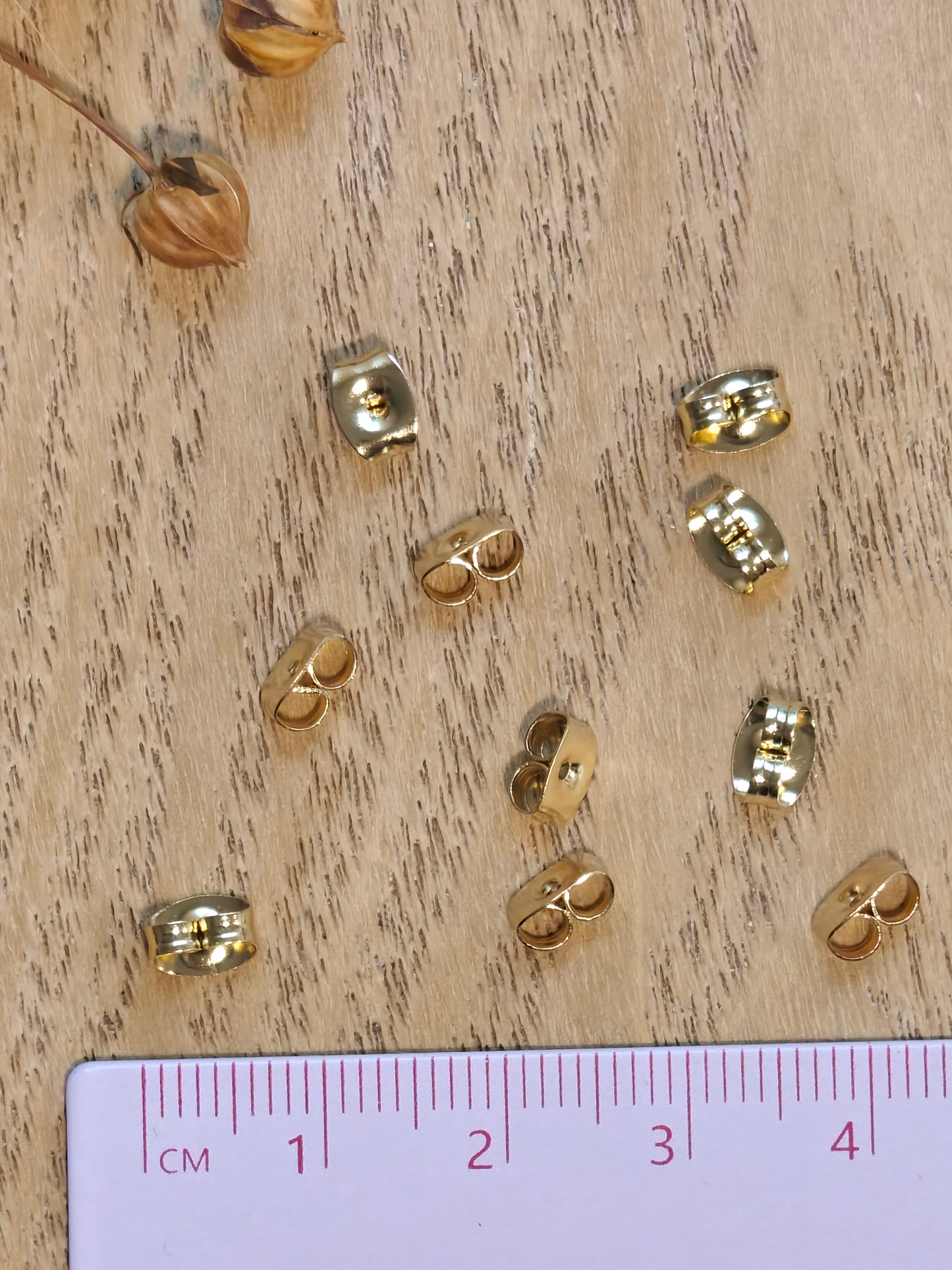 Korvakorun tausta ruostumatonteräs, 24k kultaus