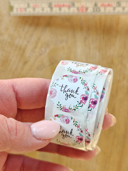 Kukallinen tarra, jossa lukee thank you